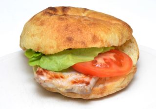 White vesalica in a bun Roštilj i Pite Kod Šavije delivery