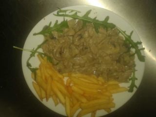 Pork in sauce with mushrooms and French fries delivery