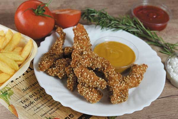 Breaded chicken sticks, sauce, fries delivery