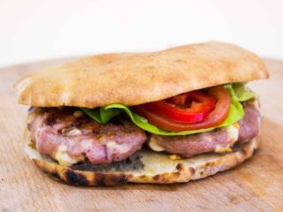 Piquant ustipak in a bun Roštilj i Pite Kod Šavije delivery