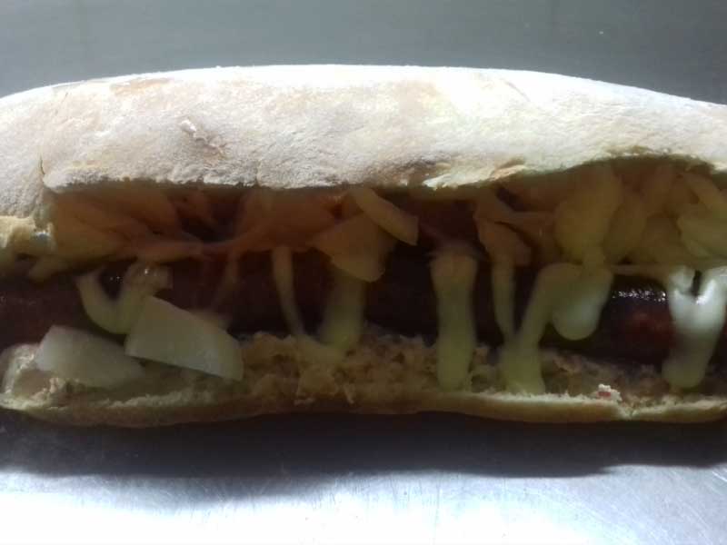 Home-made smoked sausage in bun delivery