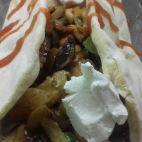 Tortilla chicken, mushrooms, lettuce, lollo rosso, dressing sauce, sour cream, ketchup delivery