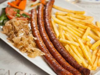 Home-made sausage with French fries delivery