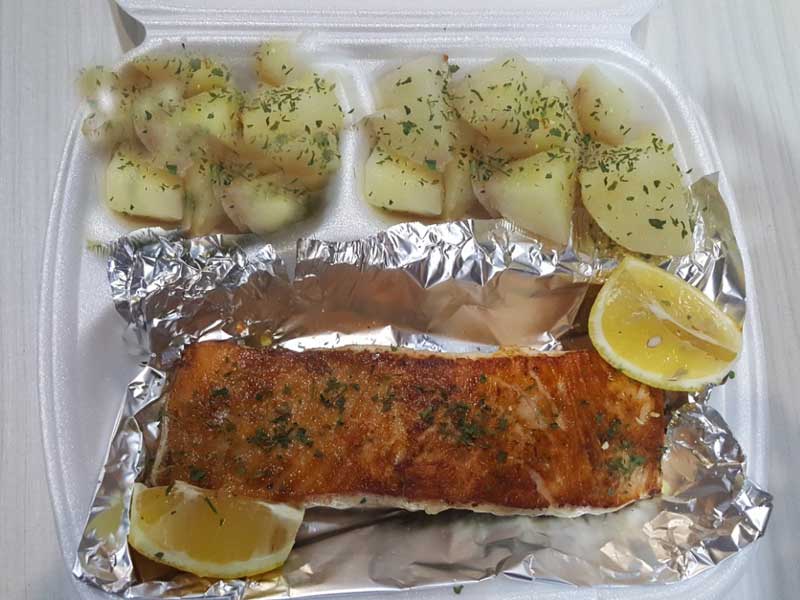 Grilled salmon fillet with side dish delivery