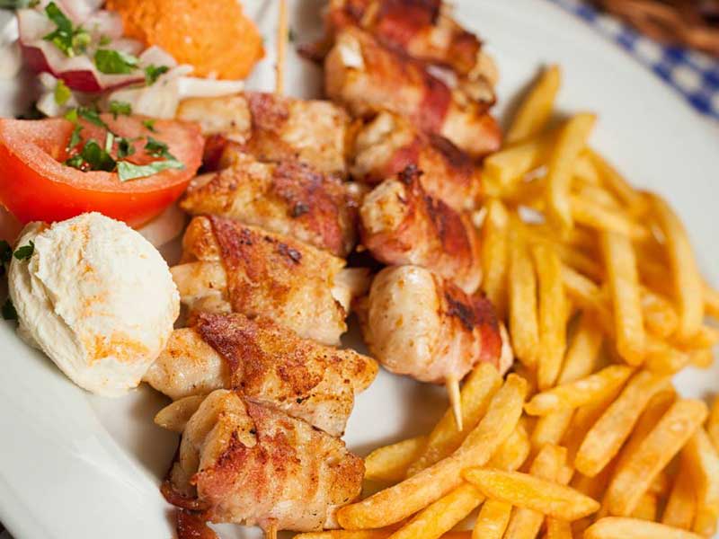 Rolled chicken kabob with French fries delivery