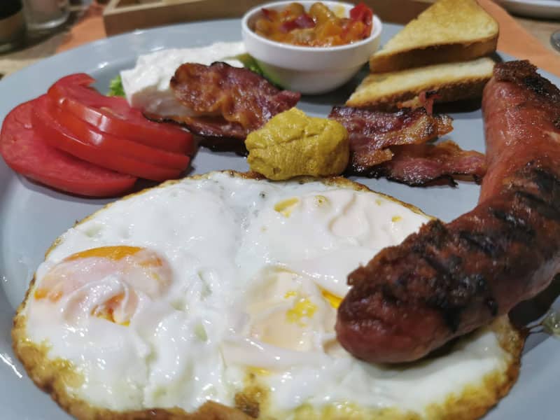 Fried eggs with sausages delivery