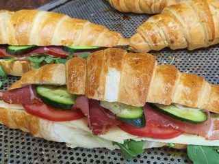 Sandwich in a croissant with prosciutto Pecivara Hart delivery
