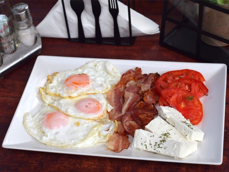 Fried eggs with bacon delivery