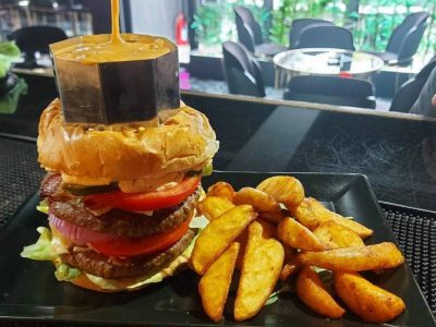 Zona melted cheese burger Zona Lounge Bar delivery