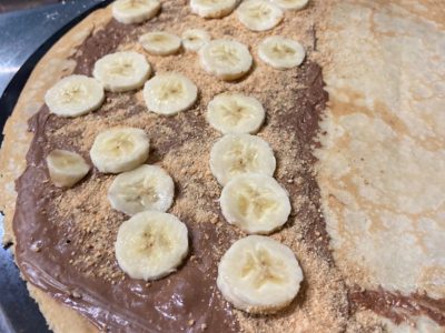Pancake with nutella, plazma biscuit and banana Prob Index Palačinkarnica delivery