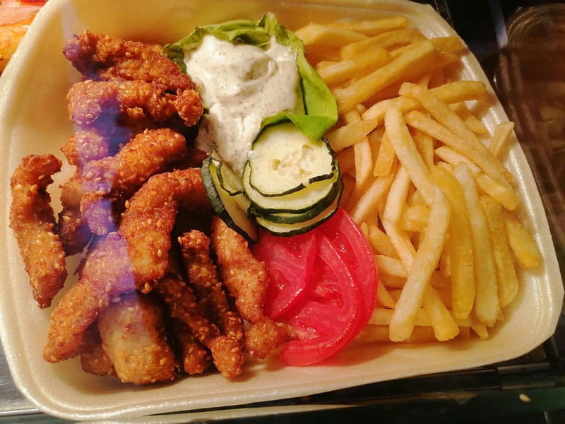 Chicken sticks with sesame and french fries delivery
