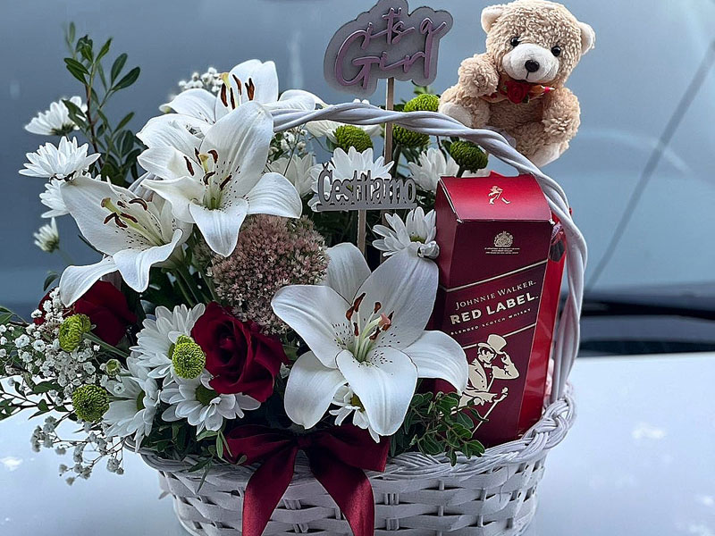 Gift basket with flowers, drink and chocolate delivery