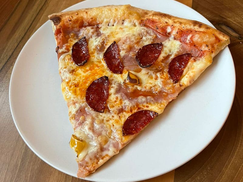 Pepperoni pizza slice delivery