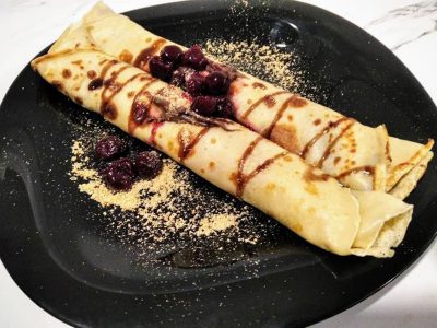 Pancakes with eurocream, plazma biscuit and banana Cyrano Caffe Pizzeria delivery