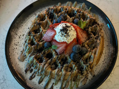 Waffle with pistachio chololate, white chocolate, oreo, strawberries House Coffee delivery