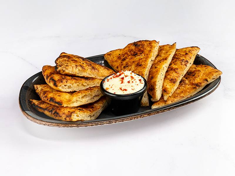 Spicy homemade flatbread with clotted cream delivery