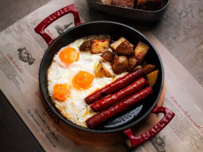 Mibrasa eggs with homemade barbecue sausage Balkan Distrikt delivery