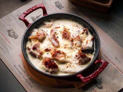 Chopped smoked leg baked in cheese sauce Balkan Distrikt delivery