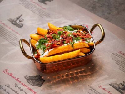 French fries on mileram with crispy bacon and scallions Balkan Distrikt delivery