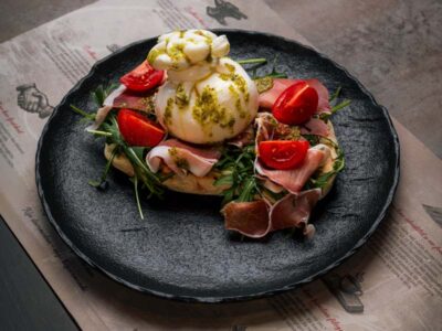 Focaccia sandwich with prosciutto and burrata Balkan Distrikt delivery