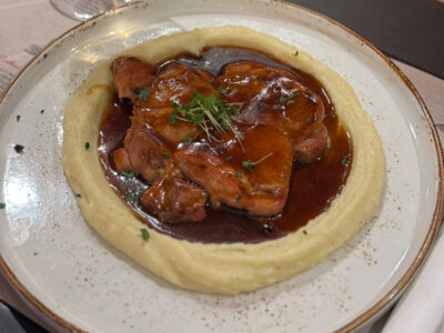Chicken durmstick in demiglas sauce on puree Balkan Distrikt delivery