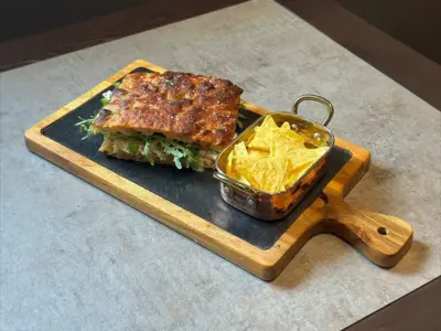 Sandwich with mortadella and cream cheese in focaccia Balkan Distrikt delivery