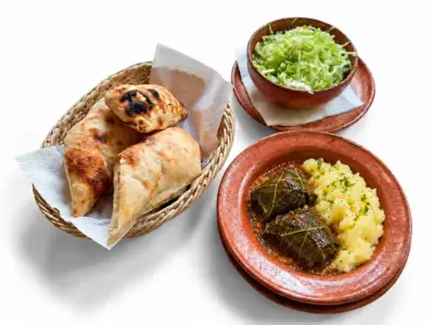 Chard sarmas, mashed potatoes, sour cream, flatbread Tri Praseta delivery